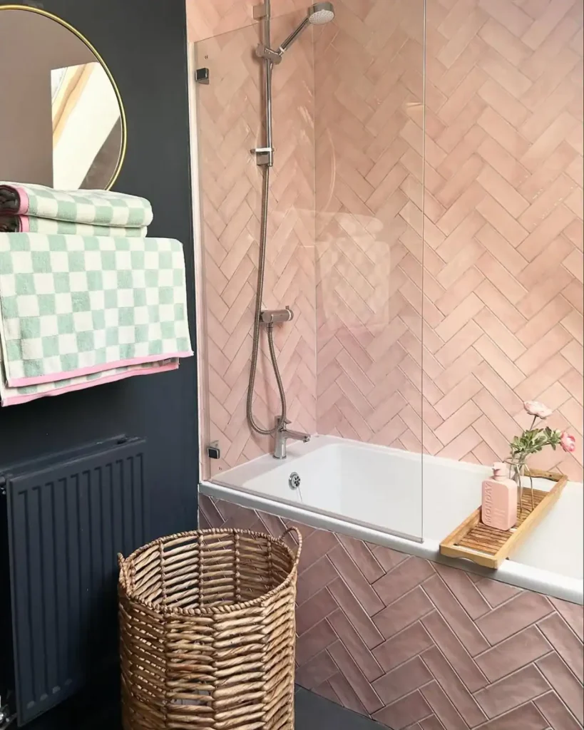 Pink and bath bathroom with customer pink tiled bath panel.