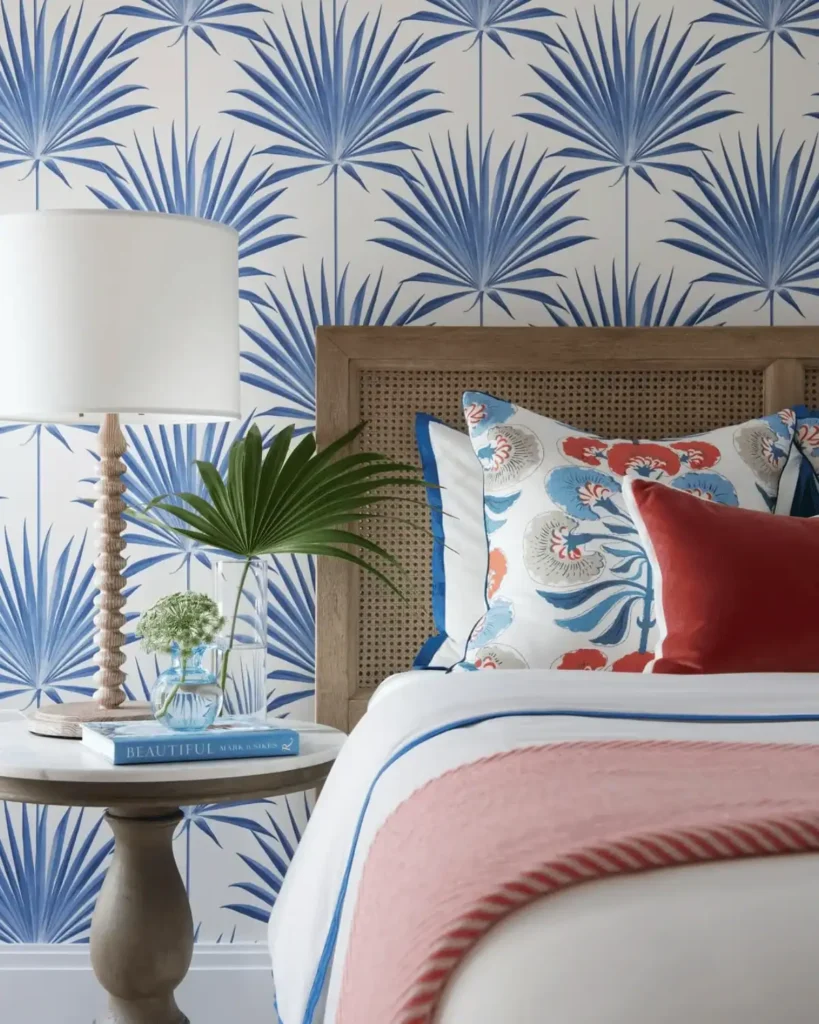 beachy bedroom with a bold plant wallpaper
