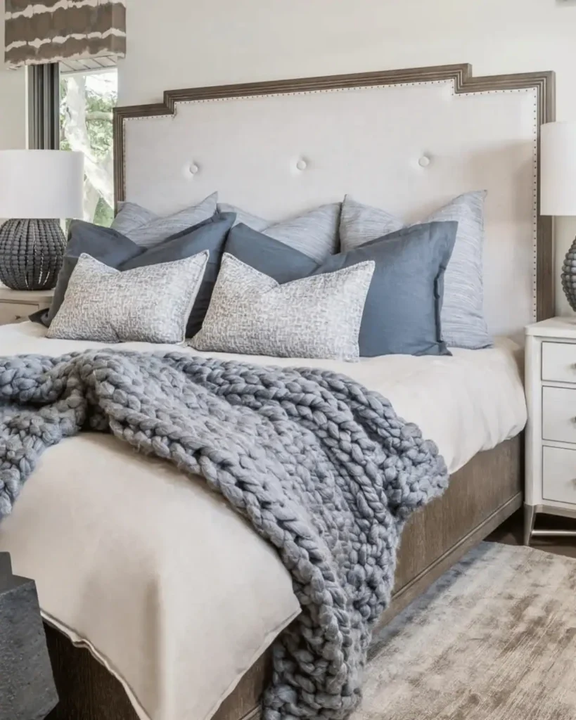 coastal bedroom idea with a thick grey knit throw