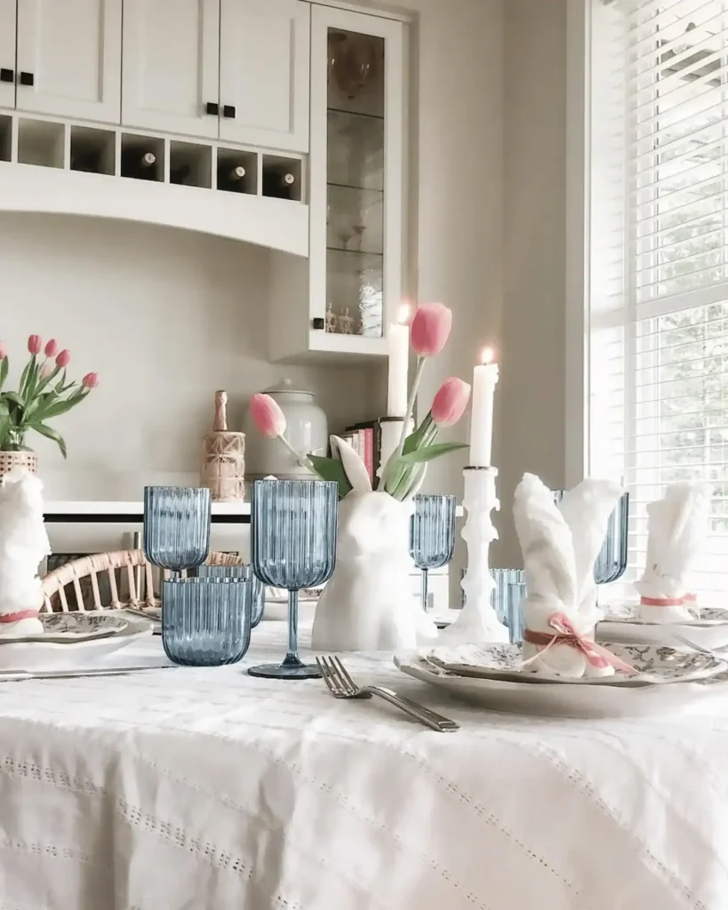 All white Easter tablescape with only blue wine glasses