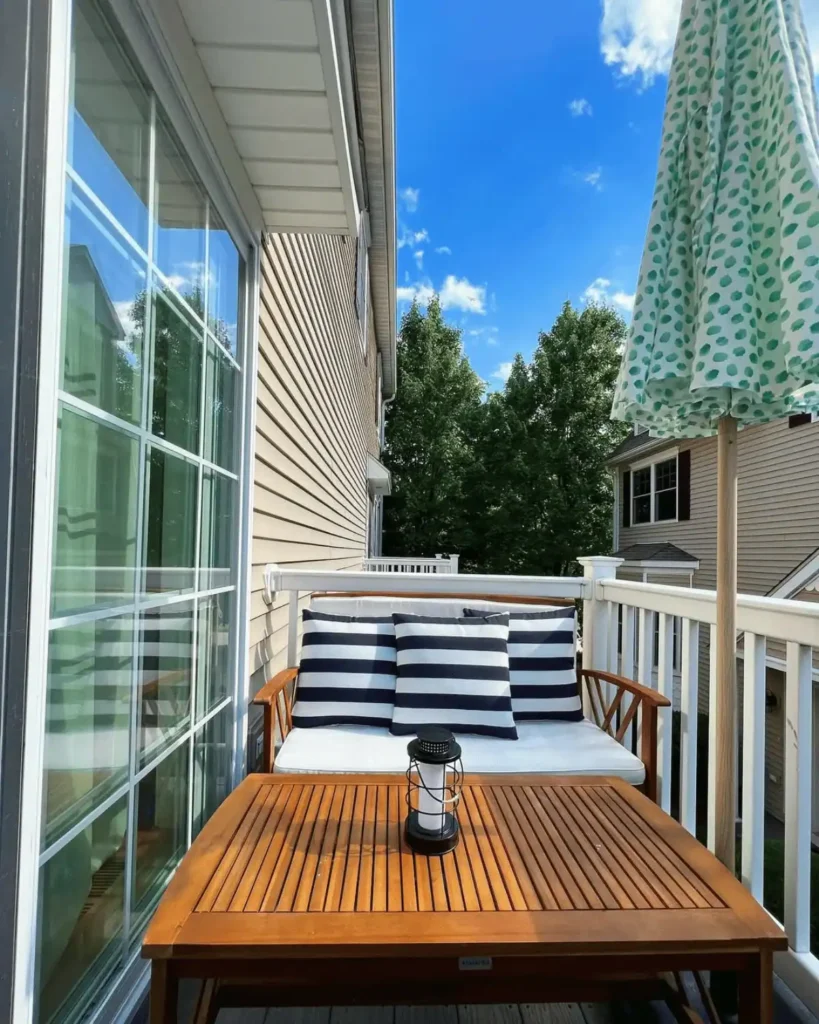 tiny patio with striped cushions