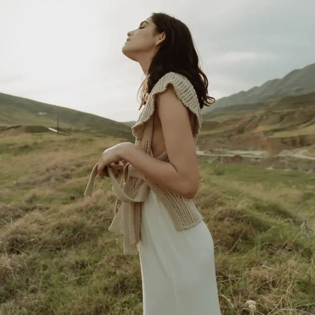 A-Woman-Standing-on-the-Grass-Field