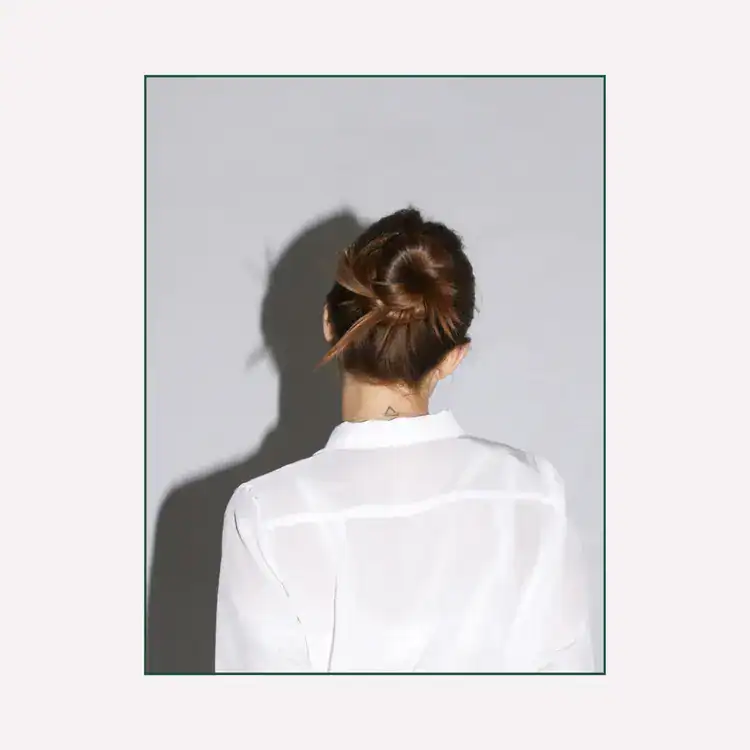 Back-View-of-a-Woman-with-a-Hair-Bun.-Signs-of-blocked-feminine-energy