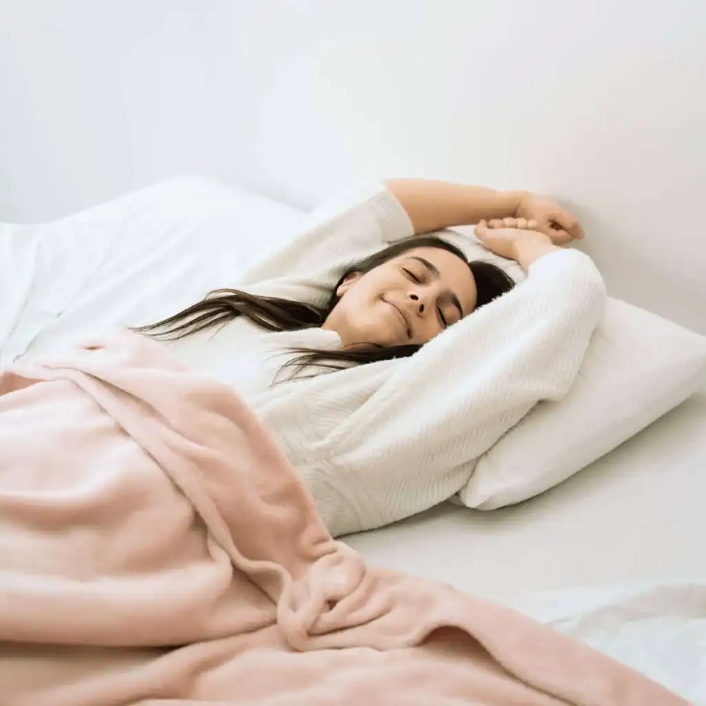 Medium-shot-woman-laying-in-bed