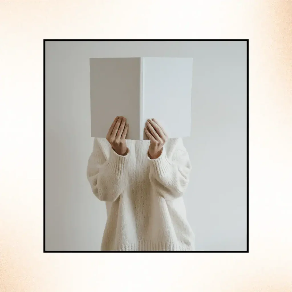 Person-covering-face-with-an-open-book