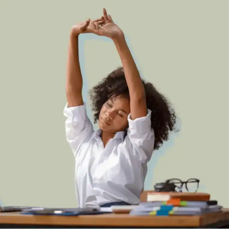 Self-Care-Morning-Rituals.-Woman-stretching-her-arms-at-a-desk