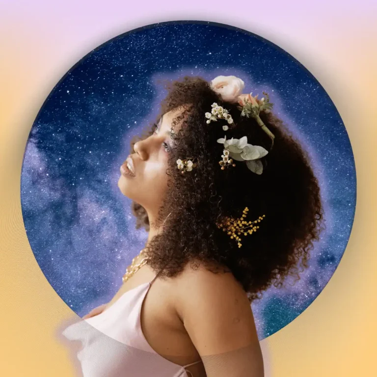 Side-view-of-woman-with-flowers-in-her-curly-hair-.Thumbnail