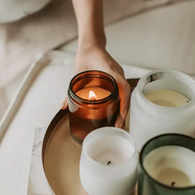 Woman-Lighting-a-Candle-in-Jar