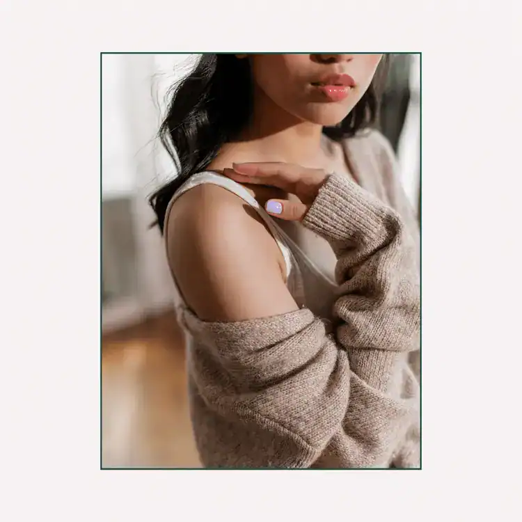 Woman-Wearing-a-Knitted-Cardigan-and-Tank-Top.Signs-of-blocked-feminine-energy