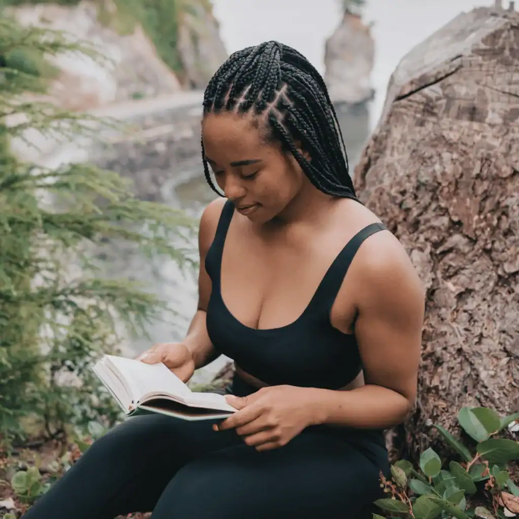Woman-in-Black-Tank-Top-Reading-Book