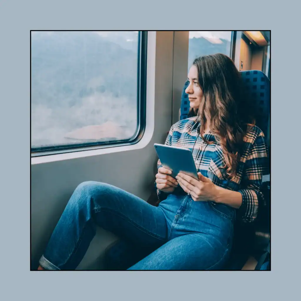 Woman-solo-traveller-on-a-train.-100-Solo-Date-Ideas