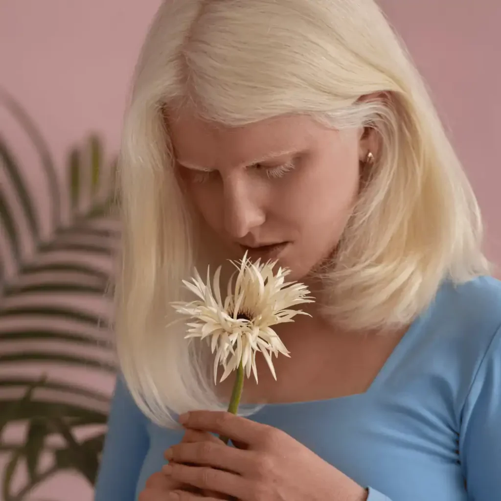 medium-shot-of-a-woman-holding-a-white-flower-sunday-self-care-quotes