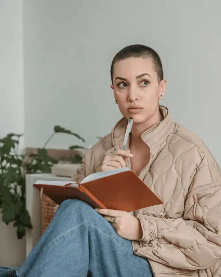 short-haired-woman-writing-in-a-journal