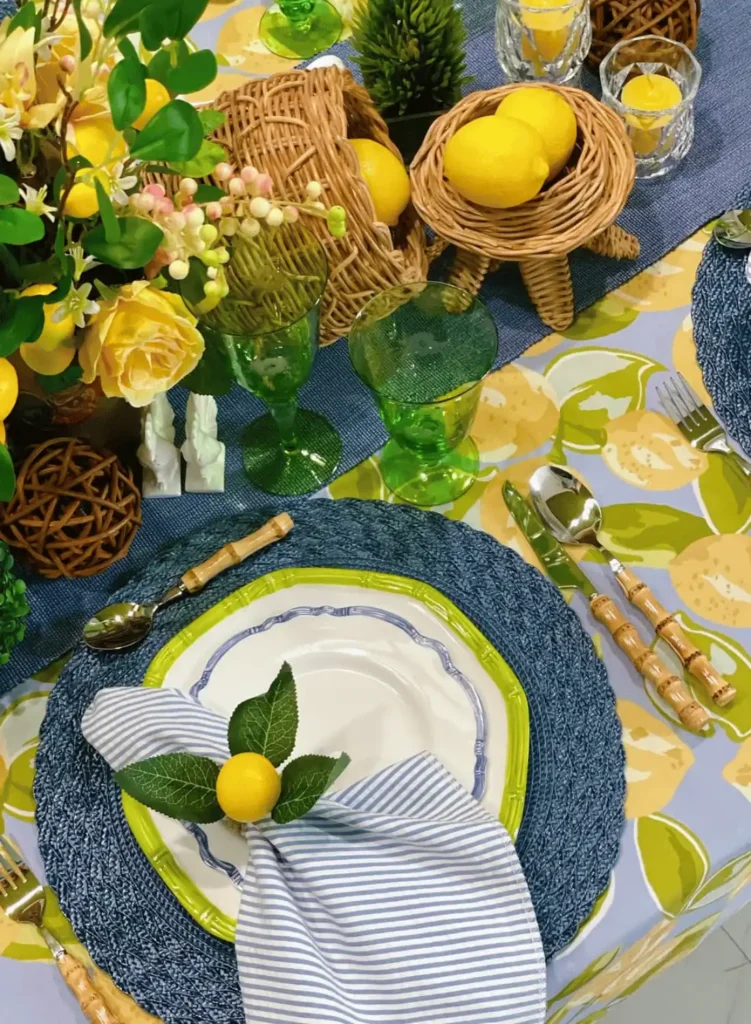 A table setting with yellow and blue plates and place settings.
