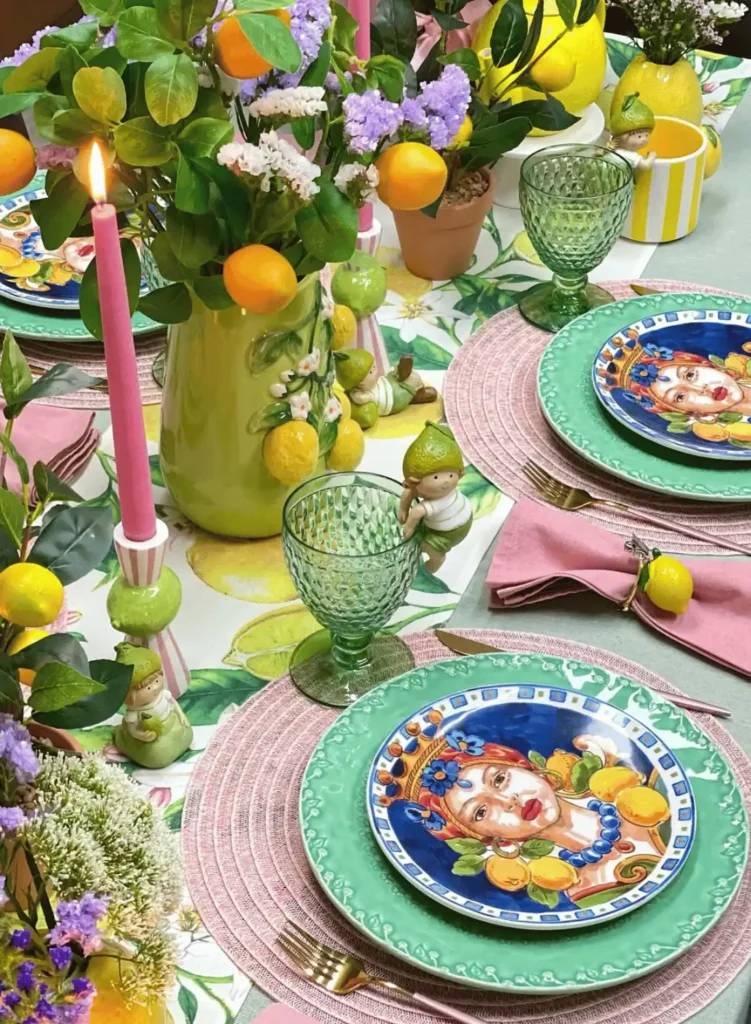 A table set with colorful plates and place settings.
