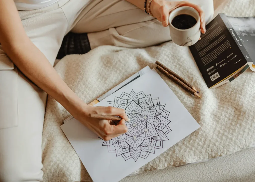 Woman Coloring A Book Page. Hobbies For Introverts