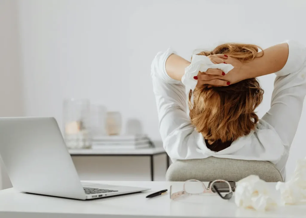 Woman in White Long Sleeve Shirt Holding a Tissue Paper. Positive Affirmations For Entrepreneurs