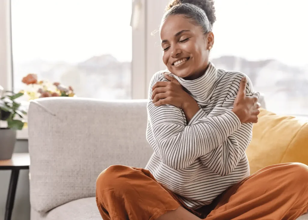 woman hugging herself. New year affiirmations