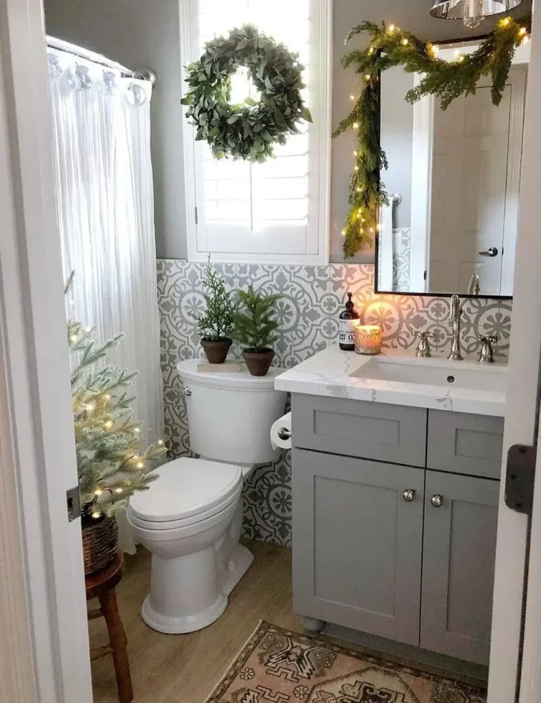 Mini Forest Bathroom With Lit Garland. Christmas bathroom decor ideas