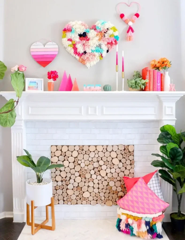 Bright + Playful Yarn-Heart Mantel. Valentine's Day Mantel Decor Ideas