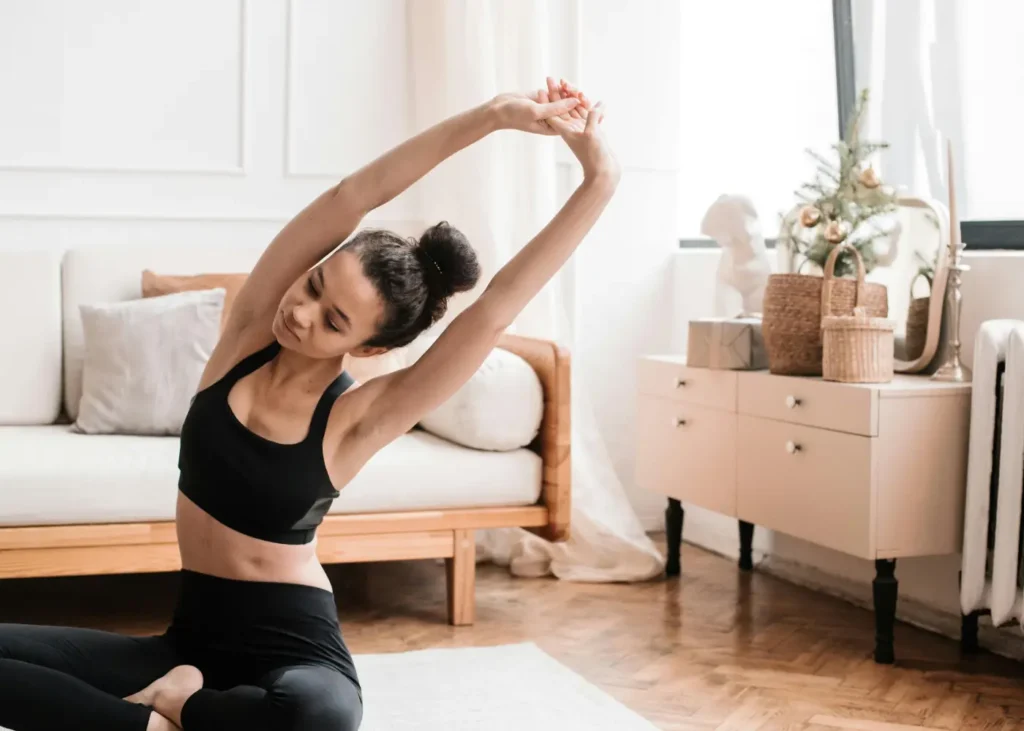 Woman Wearing Black Activewear Doing Exercise