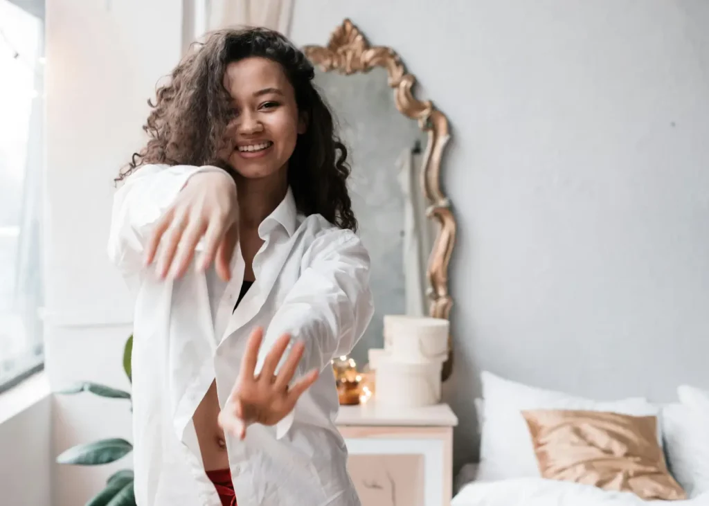 Woman in White Long Sleeve Top dancing