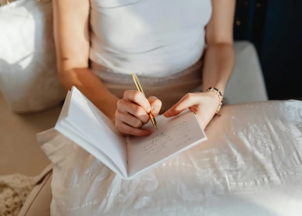 woman writing in a notepad