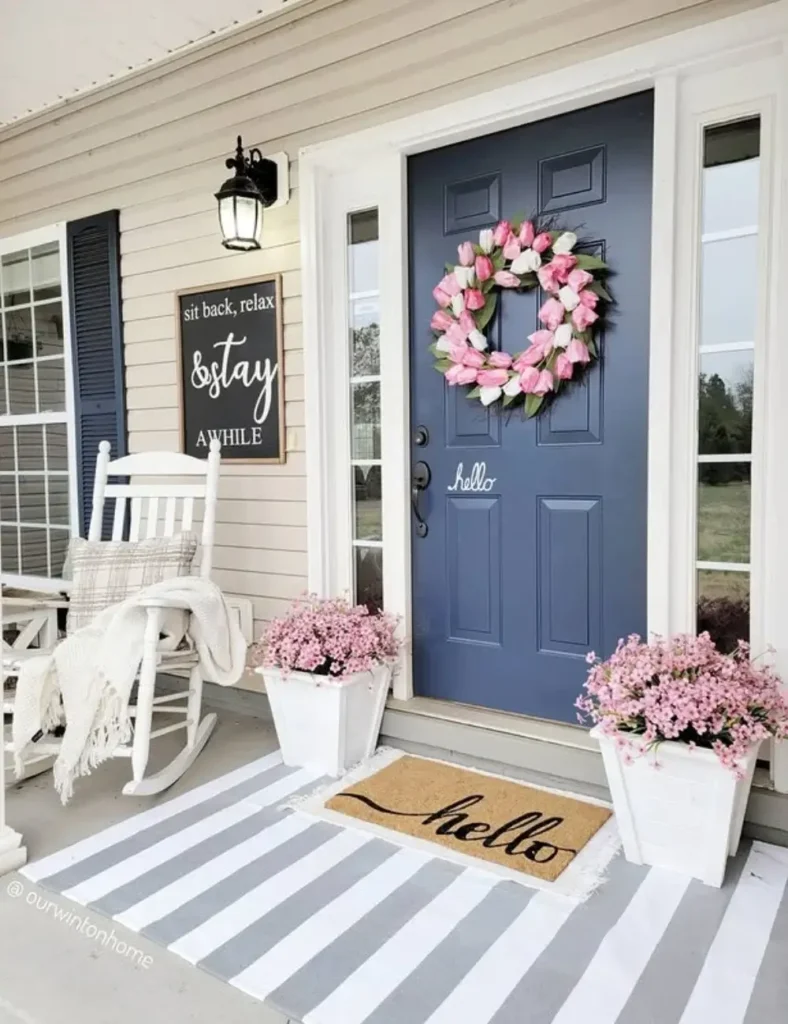 spring front porch decor with a pink wreath