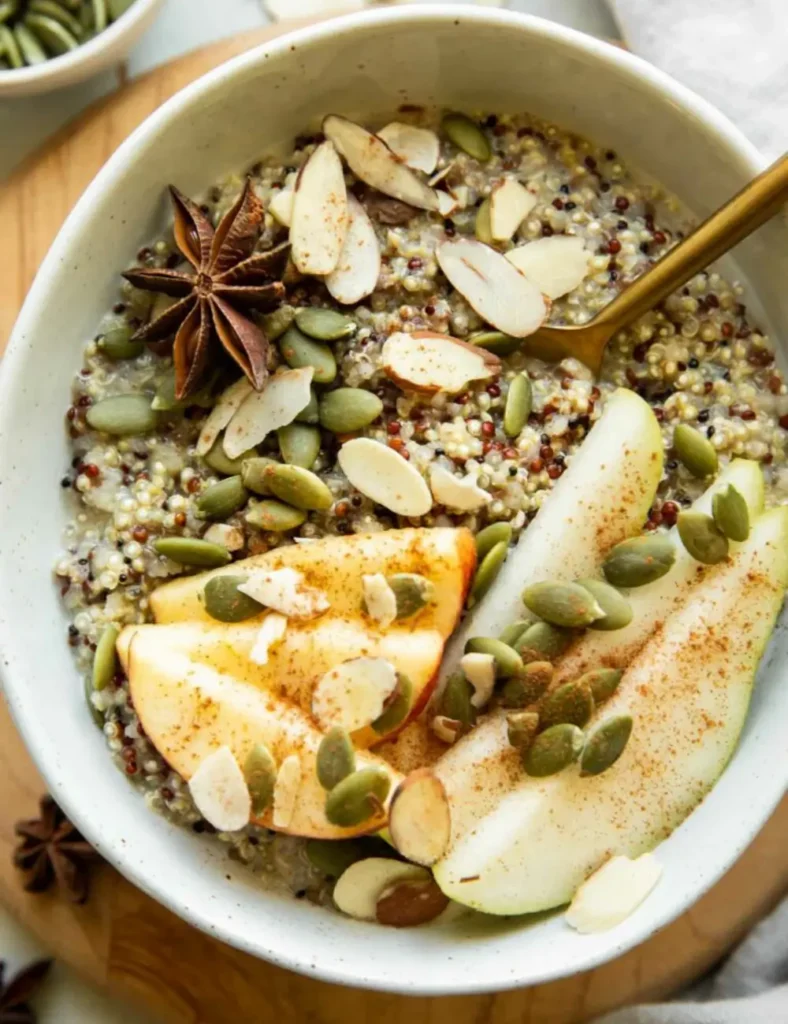 Fall breakfast quinoa bowl with roasted squash, apple and toasted seeds