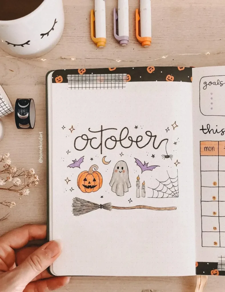 Simple hand-drawn October bullet journal cover page with a pumpkin, ghost, candles and spiderweb doodles