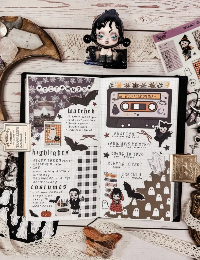 Halloween memory journal spread with a cassette tape playlist sticker, costume list and monthly highlights section