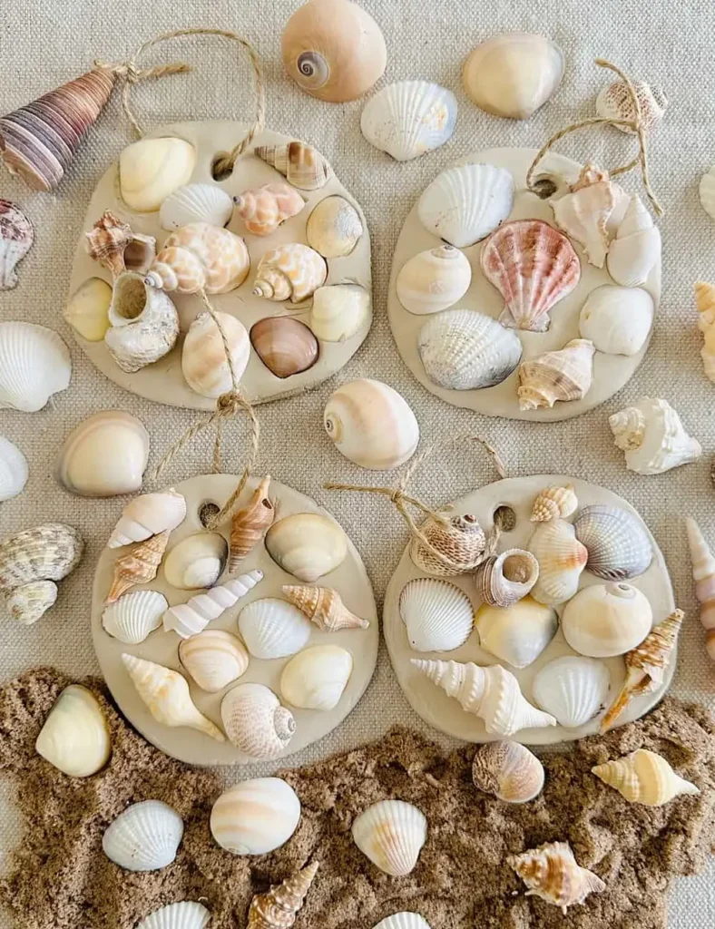 Air-dry clay ornaments with pressed seashell imprints, hanging by twine