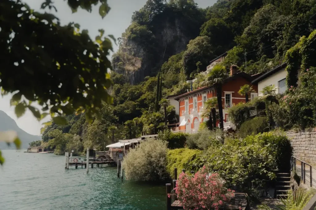 Charming villa by a serene lake in Ticino, Switzerland surrounded by lush greenery and scenic mountain views