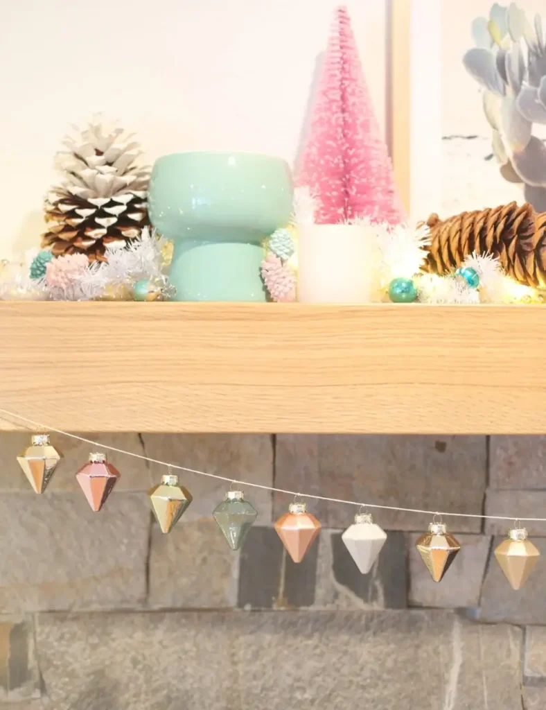 Christmas ornaments strung on twine as a simple mantel garland