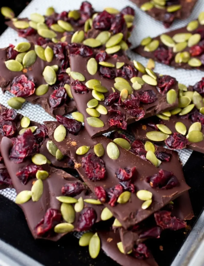 Dark chocolate bark topped with dried cranberries and pumpkin seeds