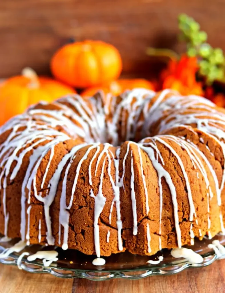 Gluten-free pumpkin bundt cake drizzled with maple vanilla glaze