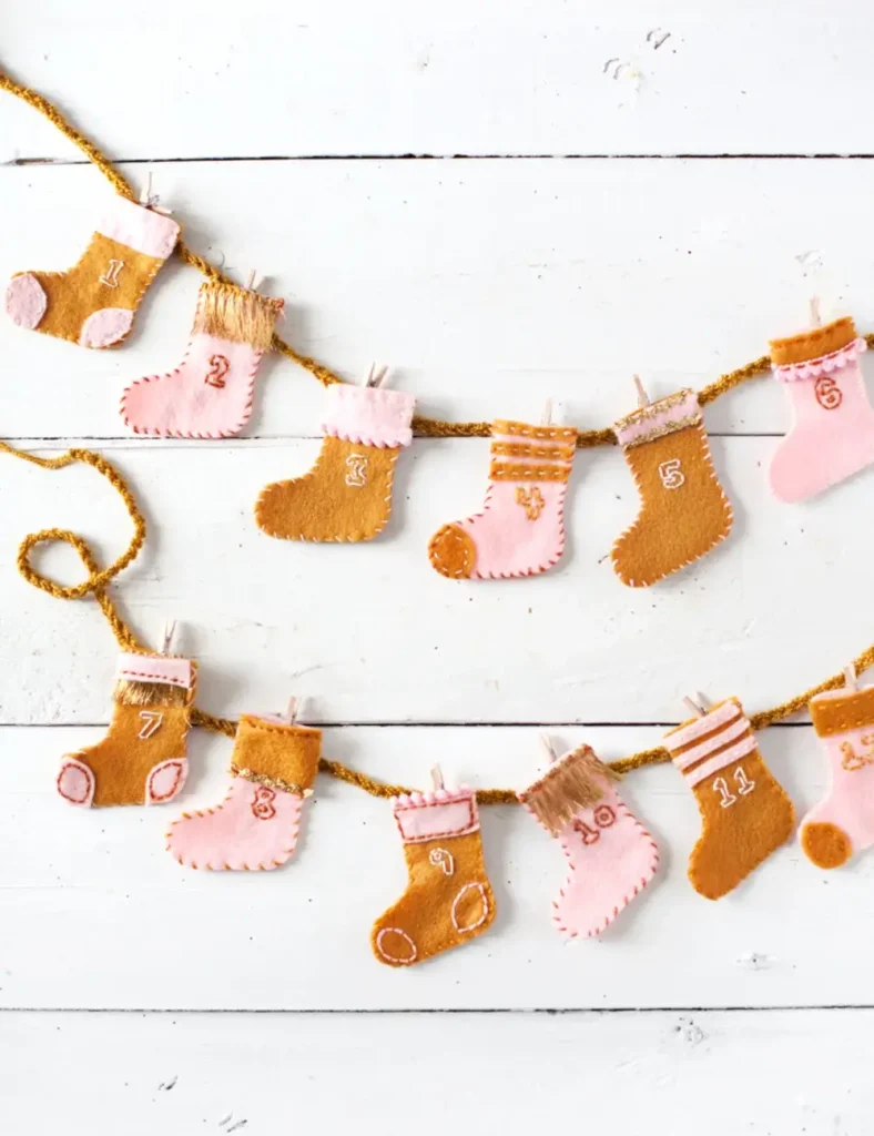 Handmade felt stocking advent calendar garland with embroidered numbers