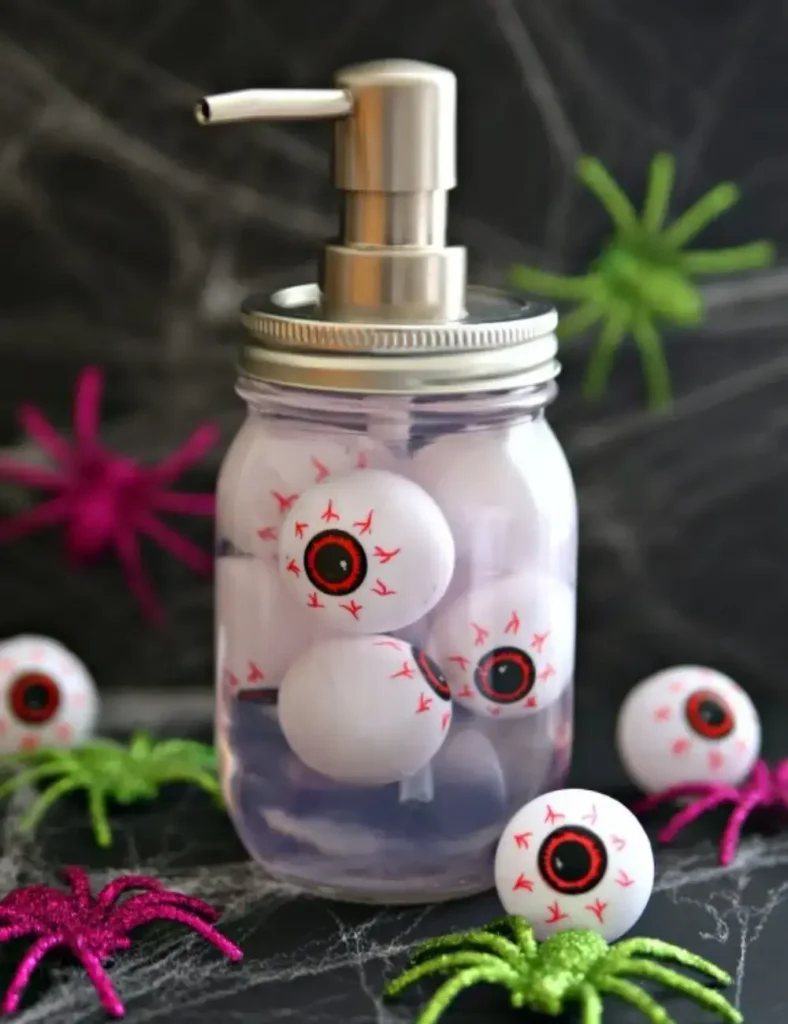 Mason jar hand soap dispenser filled with floating eyeball ping pong balls