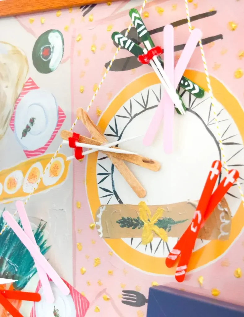 Miniature painted popsicle stick ski garland for winter decor