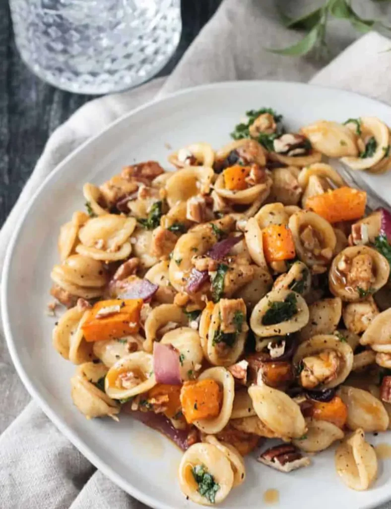 Orecchiette pasta with roasted butternut squash, kale, tempeh crumbles and chopped pecans
