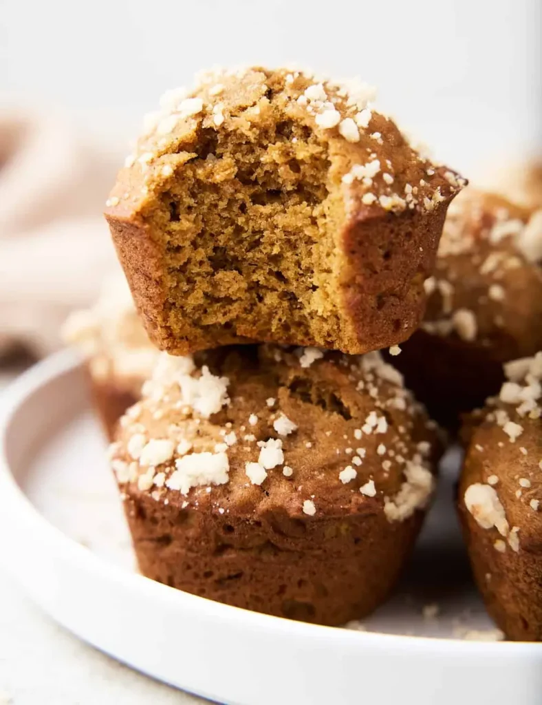 Pumpkin banana muffins with streusel topping cooling on a wire rack
