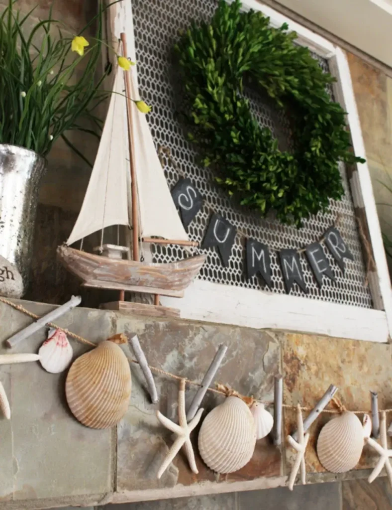 Scallop shell and starfish garland draped along a fireplace mantel