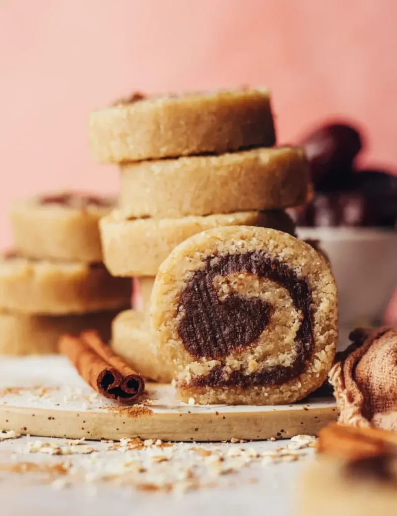 Sliced no-bake cinnamon roll bites made from oat and almond flour dough