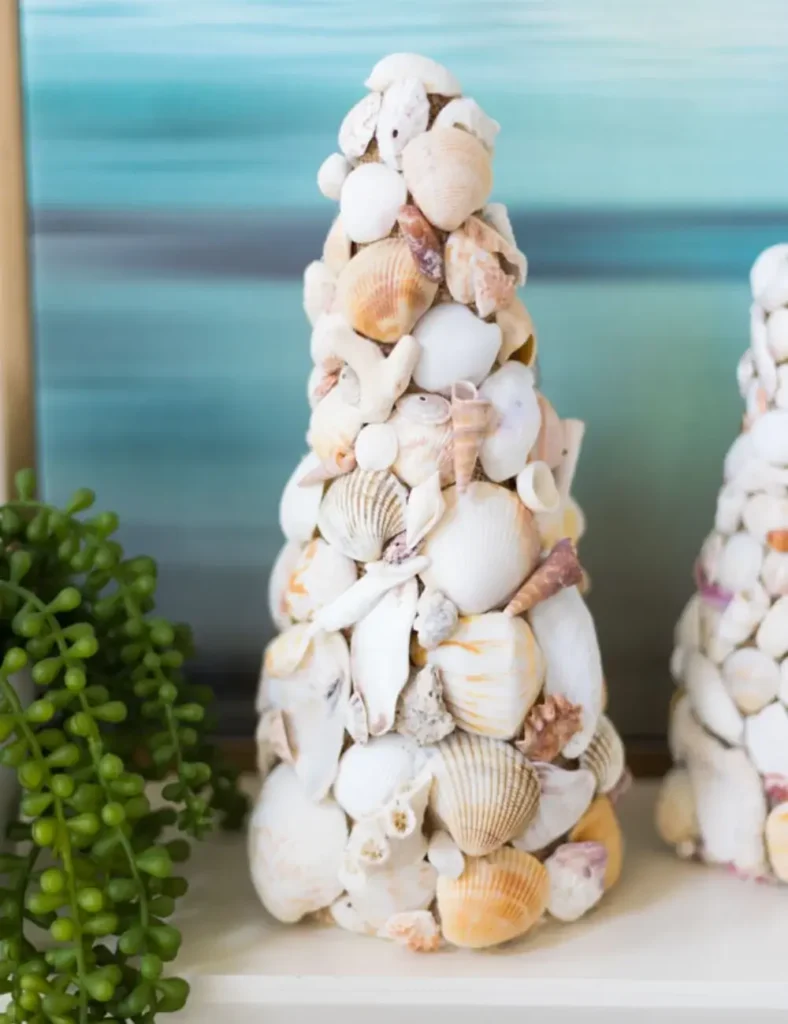 Styrofoam cone covered in burlap and seashells, styled as a decorative topiary