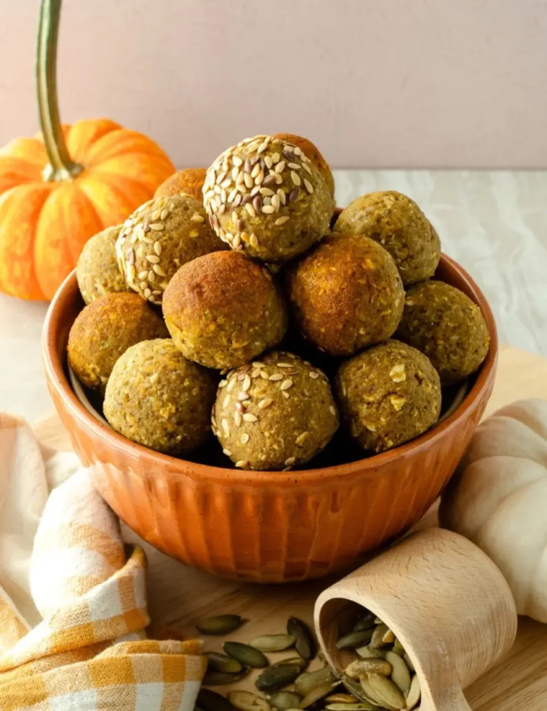 Vegan pumpkin pie energy bites rolled into balls and dusted with cinnamon