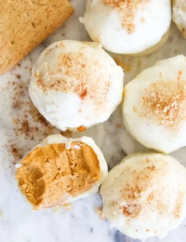 White-chocolate-dipped-pumpkin-pie-truffles-dusted-with-cinnamon-and-graham-cracker-crumbs.