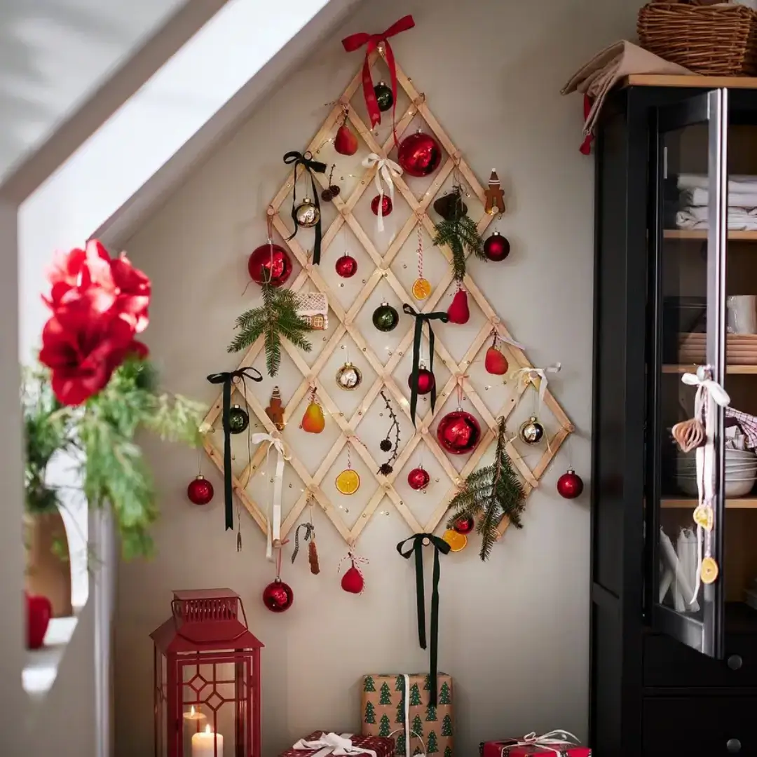 IKEA Vinterfint lattice Christmas tree decorated with red baubles, ribbons, and pine sprigs