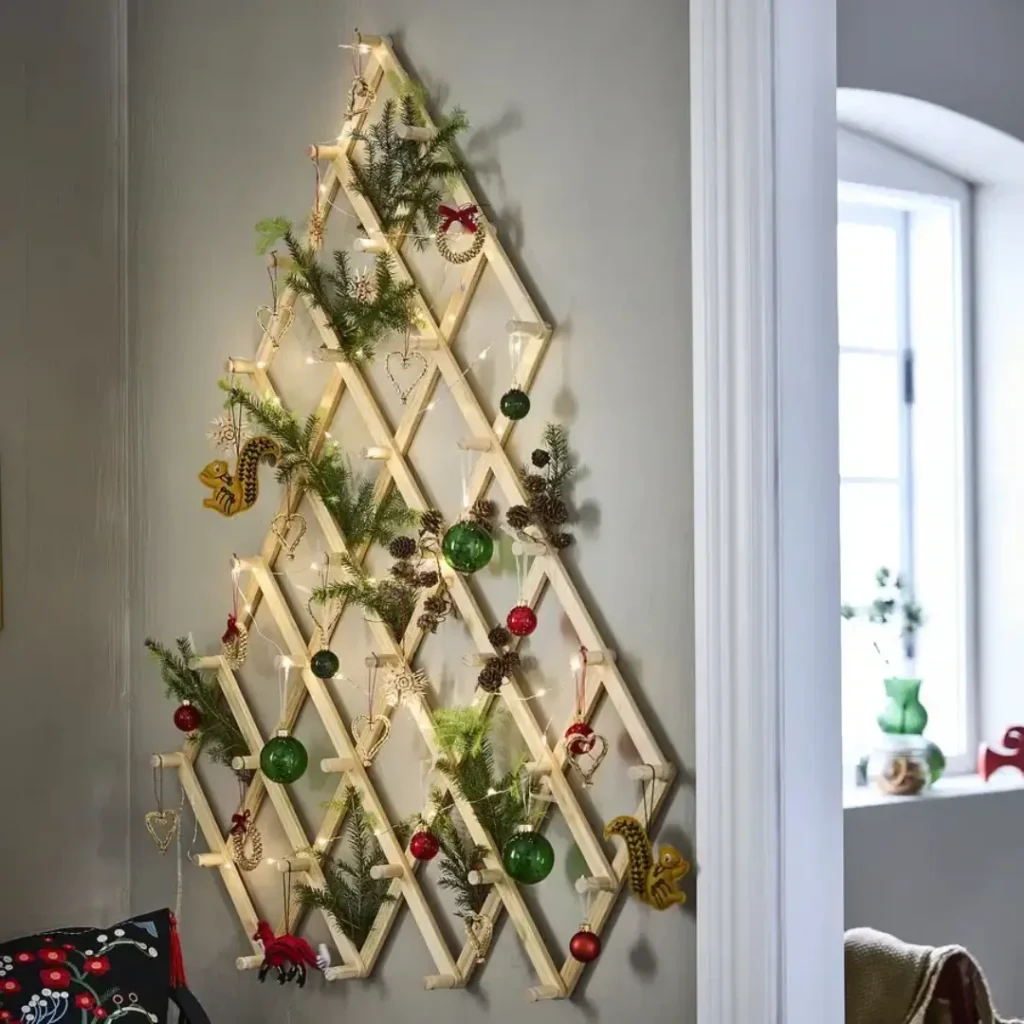 IKEA Vinterfint wall Christmas tree with green baubles, pinecones, and fairy lights