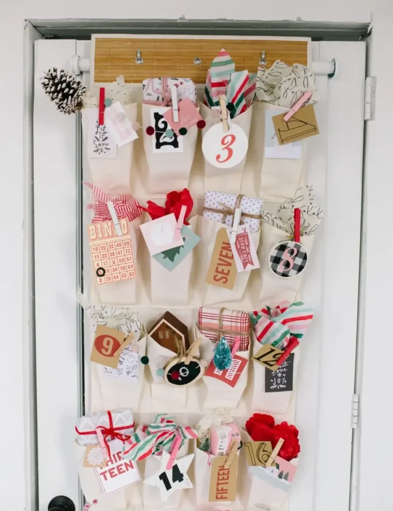 Over-the-door shoe organizer decorated and used as a numbered Christmas advent calendar