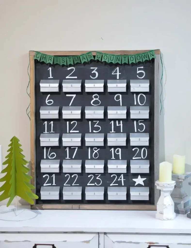 Rustic farmhouse advent calendar with metal-look paper mailboxes on a chalkboard background